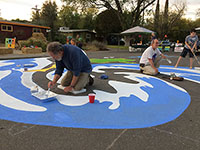 painting water stream on street mural