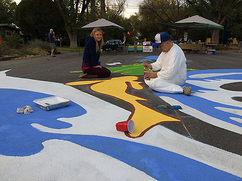 painting another coat of yellow on the fish