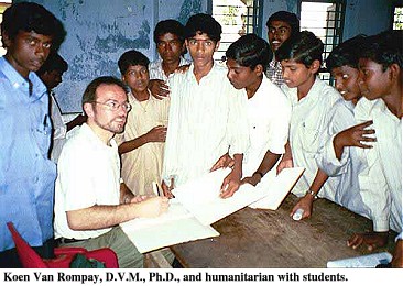 Koen Van Rompay, D.V.M., Ph.D., and humanitarian with students.