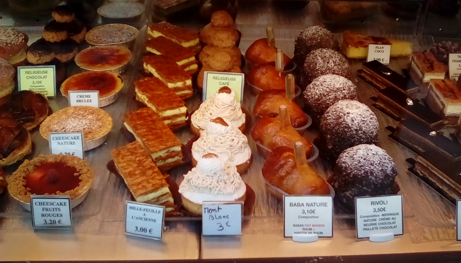 photo of pastries in paris bakery window